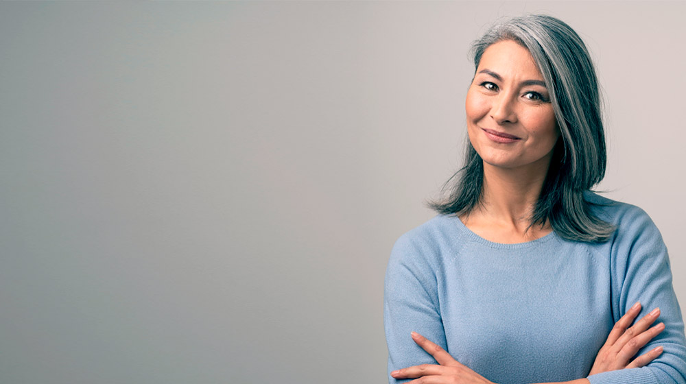 portrait of a pretty middle aged woman with grey hair