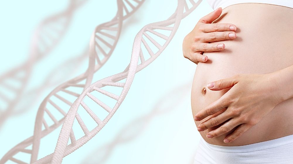 Young pregnant woman caress belly among DNA stem | Feature | Pregnancy May Switch Off Cancer Genes In Mother